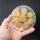 Selenit Untersetzer - Buddha gold 10cm