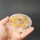 Selenit Untersetzer - Buddha gold 10cm